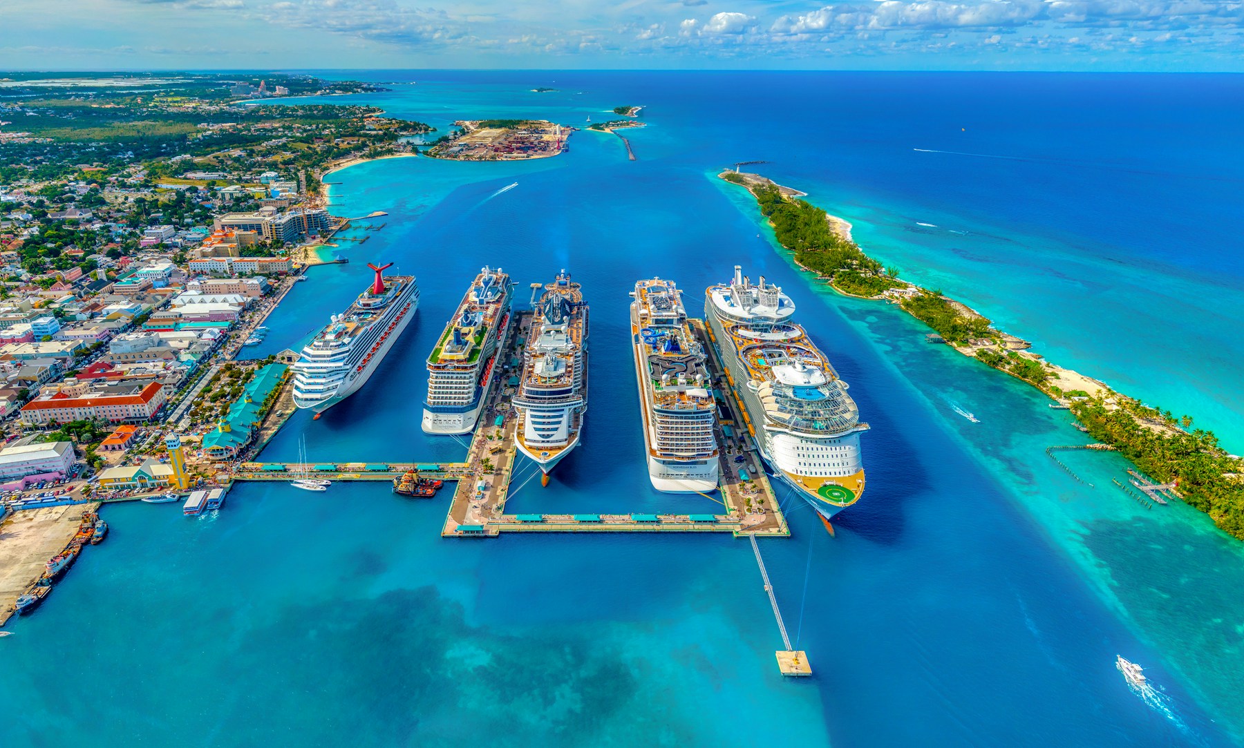 Cruise ships docked beside turquoise Caribbean waters